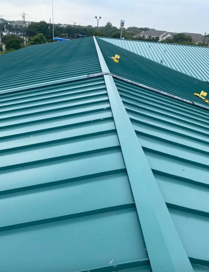 Green commercial metal roof ridge and valley for Metal Roof Repair in Cadillac